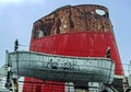 Graffiti eyes on rusty life boat of abandoned cruise ship Duke of Lancaster Royalty Free Stock Photo