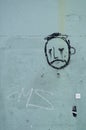 Graffiti, face of a sad looking man on a wall Royalty Free Stock Photo