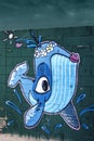 Graffiti with fish on beach wall