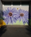 Graffiti, flowers on an entrance to the electric transformer