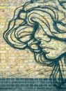 Graffiti girl in profile with big hair - green tone