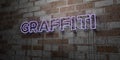 GRAFFITI - Glowing Neon Sign on stonework wall - 3D rendered royalty free stock illustration