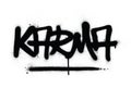 Graffiti karma word sprayed in black over white