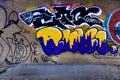 Graffiti message. Spary graffiti drawing on city block walls. Texture on cement. Royalty Free Stock Photo