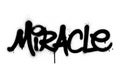 Graffiti miracle word sprayed in black on white