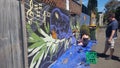 Graffiti - A mural being painted on a wall in Newtown Sydney NSW Australia