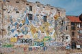 Graffiti and mural paintings on building facade next to Kunsthaus Tacheles, a former art center in Berlin