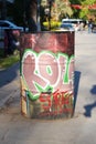 Graffiti in oil barrel. Blur background.