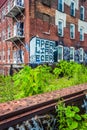 Graffiti on an old brick building, seen from the Reading Viaduct Royalty Free Stock Photo