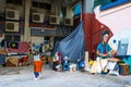 Graffiti painted street in kuala lumpur. Guy works on laptop