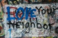 Graffiti painted on a wall with a message of LOVE