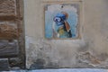 Graffiti painting on wall: modern scene of Jan Vermeer `Girl with pearl earring`