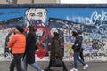 Graffiti and people at the East Side Gallery in Berlin Royalty Free Stock Photo