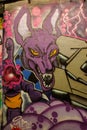 Graffiti featuring a stylized, purple anthropomorphic character with large ears. Leake street, UK Royalty Free Stock Photo