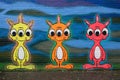 Three colorful alien graffiti