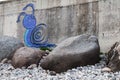 Graffiti snail on a gray wall