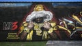 Graffiti style mural featuring Rapper Mo3 on Fabrication Street in Dallas, Texas.