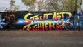 Graffiti style mural by Michael McPheeters on a wooden fence on `Go Paint Day` at the Fabrication Yard in Dallas, Texas.
