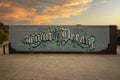 Graffiti style mural titled `Livin the Dream` on the side wall of a LED tattoo parlor in Dallas, Texas.