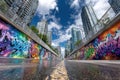 Graffiti Underpass with Modern City Buildings Royalty Free Stock Photo