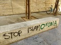 Text on a street in Zamora showing two different positions on the issue of Islamophobia, Zamora, Spain