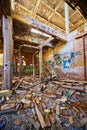 Graffiti on wall of abandoned decaying building with stairs that go nowhere