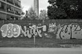 Graffiti wall along a way through a park