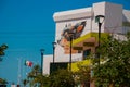 Graffiti on the wall of a building in the city Campeche, drawing a male head and a dog. San Francisco de Campeche, Mexico. Royalty Free Stock Photo