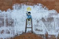 Graffiti on wall, child sitting on high chair with trident above his head, concept of freedom struggle