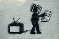 Graffiti on the wall. Television zombies.