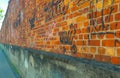 graffitied brick wall in perspective