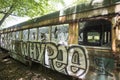 Grafitti on abandoned trolley car in woods