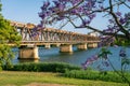 Grafton bridge with blossoming jacaranda tree in the foreground in Grafton, NSW, Australia