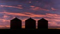 Grain bins at sunset Royalty Free Stock Photo