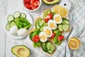 Grain bread sandwiches for breakfast, snacks toasts avocados, eggs, tomatoes, cucumbers. Keto diet. Healthy eating and food,