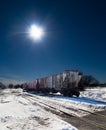 Grain Train Car with sun background. Royalty Free Stock Photo