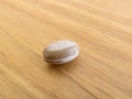 A grain of carioca beans, on a wooden table.