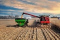 grain cart being loaded with corn from a combine harvester in northern Illinois