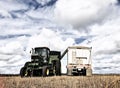 Grain cart unloading into a tractor trailer Royalty Free Stock Photo