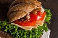 Grain croissant sandwich on a whiteboard and a dark background Royalty Free Stock Photo