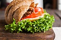 Grain croissant sandwich on a whiteboard and a dark background Royalty Free Stock Photo