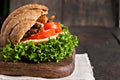 grain croissant sandwich on a whiteboard and a dark background Royalty Free Stock Photo