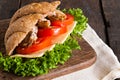 Grain croissant sandwich on a whiteboard and a dark background Royalty Free Stock Photo