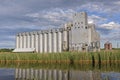 Grain Elevator Along a Quiet Shore Royalty Free Stock Photo