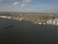 Grain elevator in the port on the river bank. Huge stainless steel tanks for storing crops. Aerial drone or quadrocopter aerial Royalty Free Stock Photo