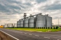 Grain elevator silos for storage and drying of grains, wheat, corn, soy, sunflower Royalty Free Stock Photo