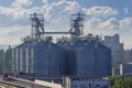 Grain elevator with steel silos in seaport Royalty Free Stock Photo