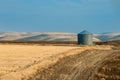 Grain storage bin and rolling hills in central Oregon