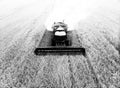 Grain harvester at work. Combine harvester with straw chopper works in the wheat field. Harvesting Wheat in slow motion Royalty Free Stock Photo