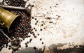 Grain roasted coffee in a mortar with pestle.